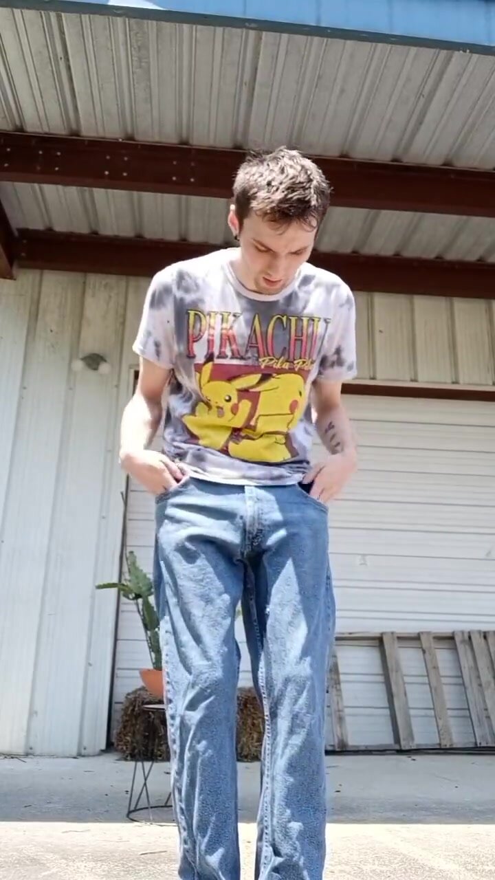 pissing in his trousers outdoors