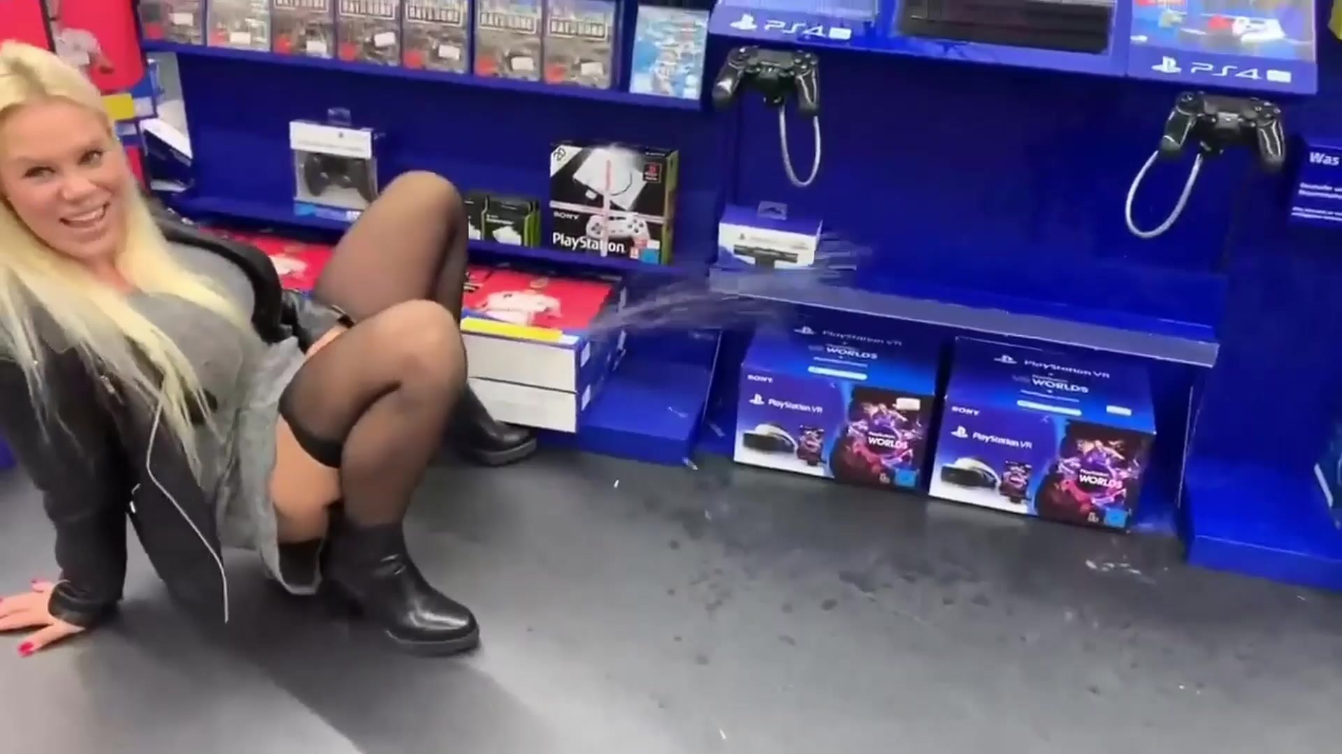 Women pissing on a playstation in store!