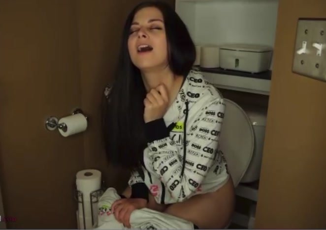 Sexy model peeing on toilet