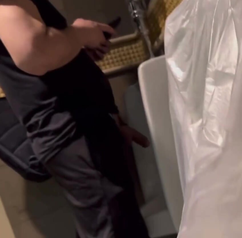 huge cock distracted on phone at urinal
