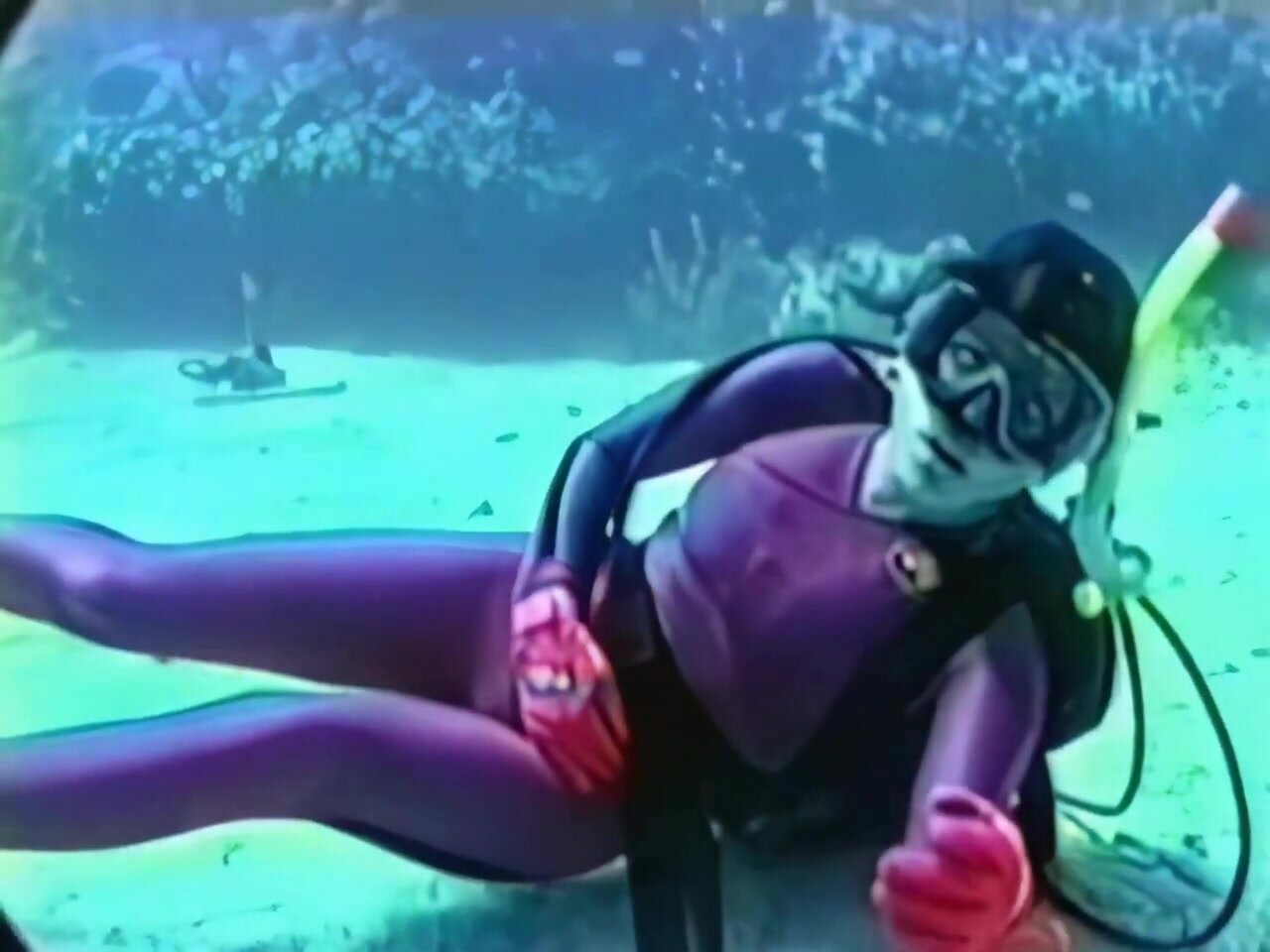 Sexy wetsuit girl drowning