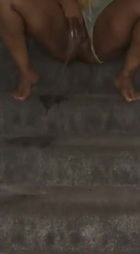 ebony pisses on the stairs