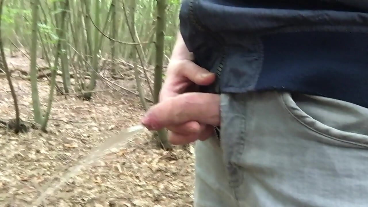 Uncut cock takes a hard piss in forest