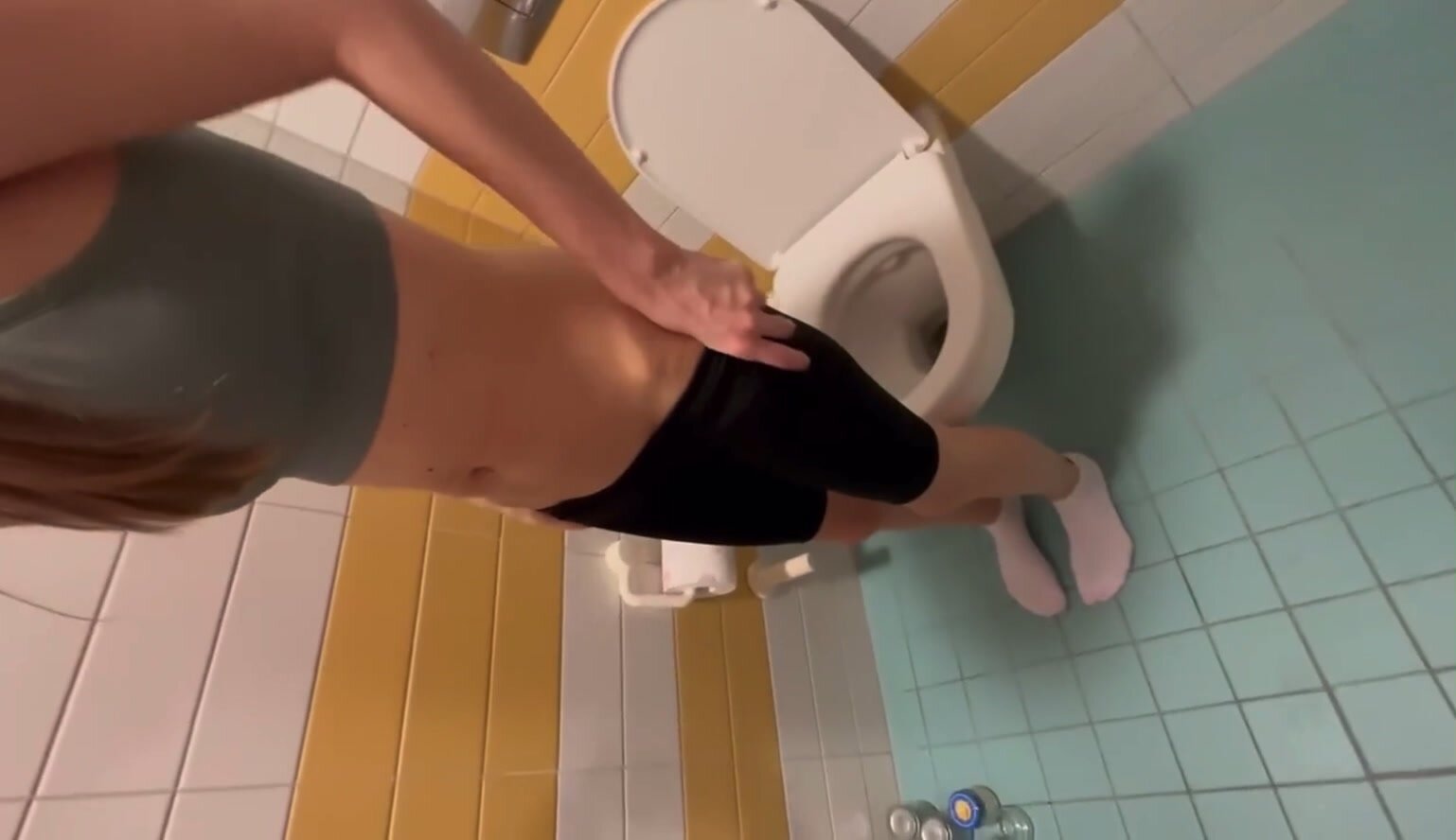 Girl squats over toilet