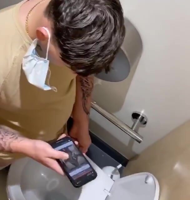 muscle guy cums in a public toilet