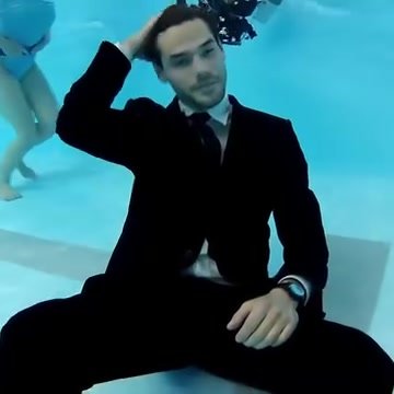 Cutie barefaced underwater in suit