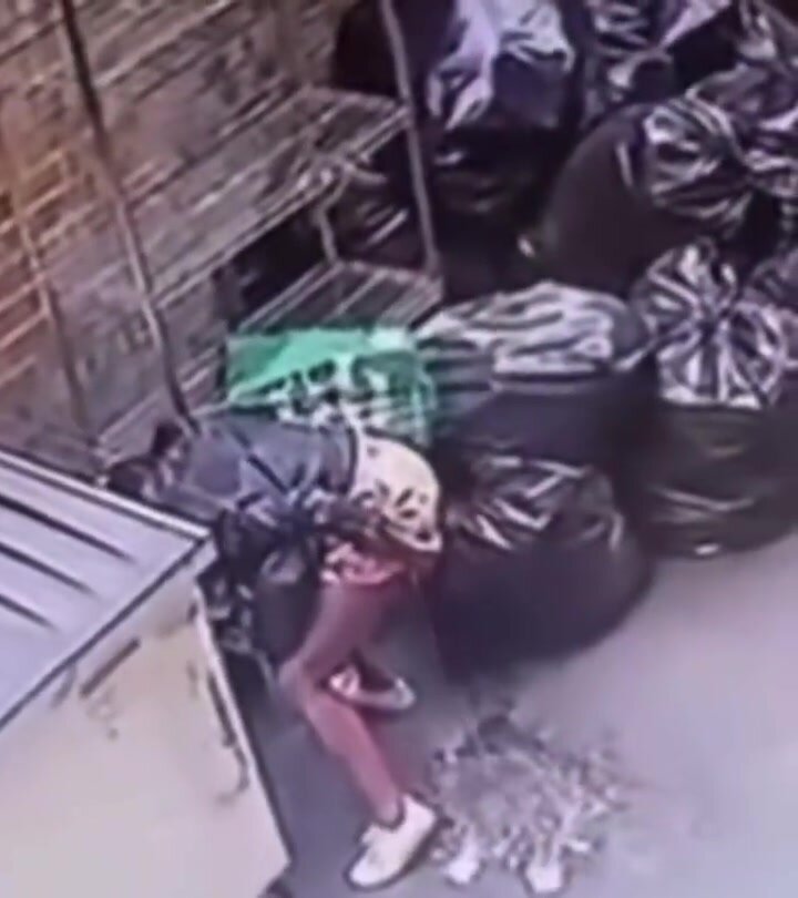 Cctv catches a public high squat piss by the garbage