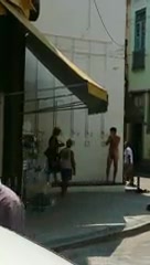 Naked guy showering in public