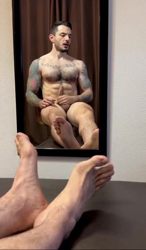 showing off his feet while jerks off
