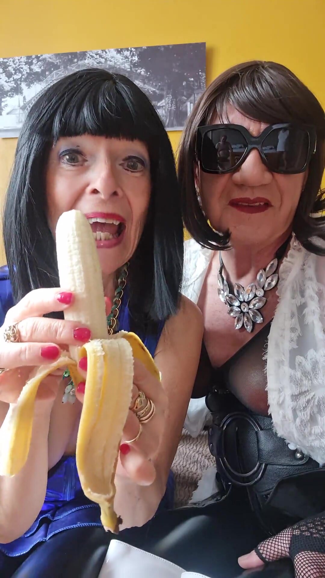 Female and shemale eating banana