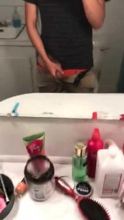 Latino twink jerks in front of mirror