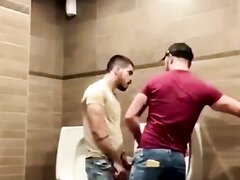 Hot Latino guys taking risks in a restroom
