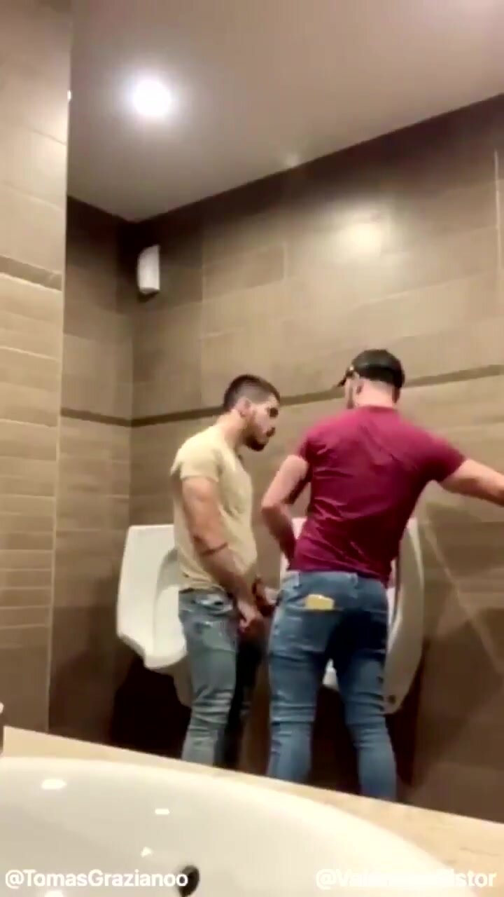 Hot Latino guys taking risks in a restroom