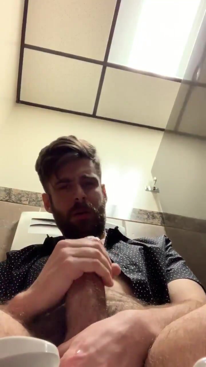 bearded guy self facial in public bathroom