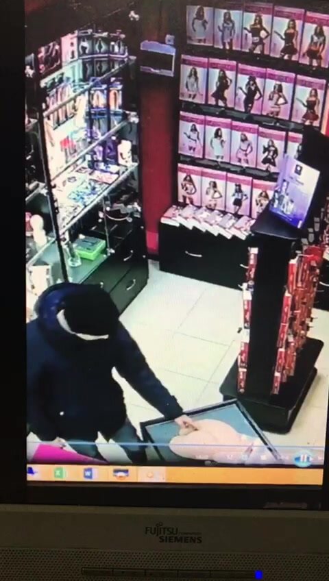 Exhibitionist fucking a toy in a sexshop