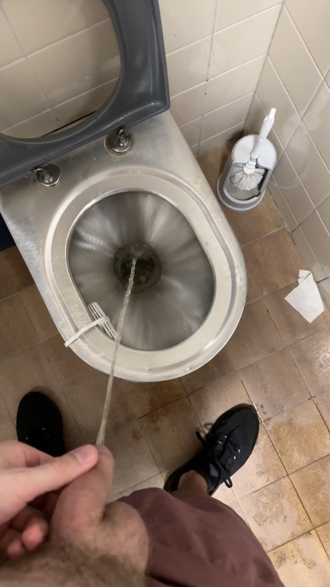 Messy pissing on public toilet