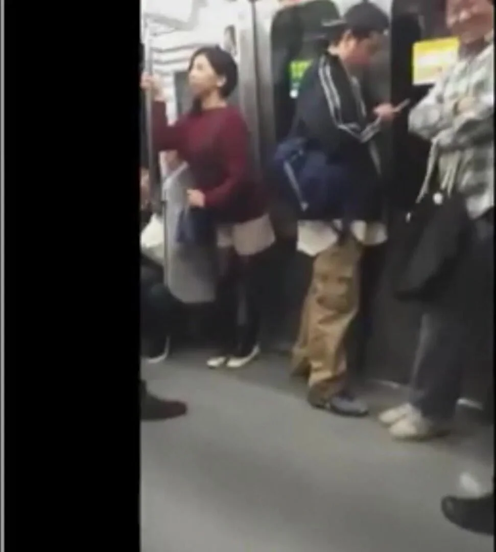 Japanese woman holding pee on train - ThisVid.com