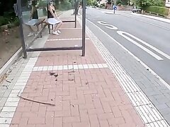 Masked shaved chick floods the bus stop as cars driveby