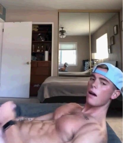 ripped straight guy with baseball hat on pumps out a lo