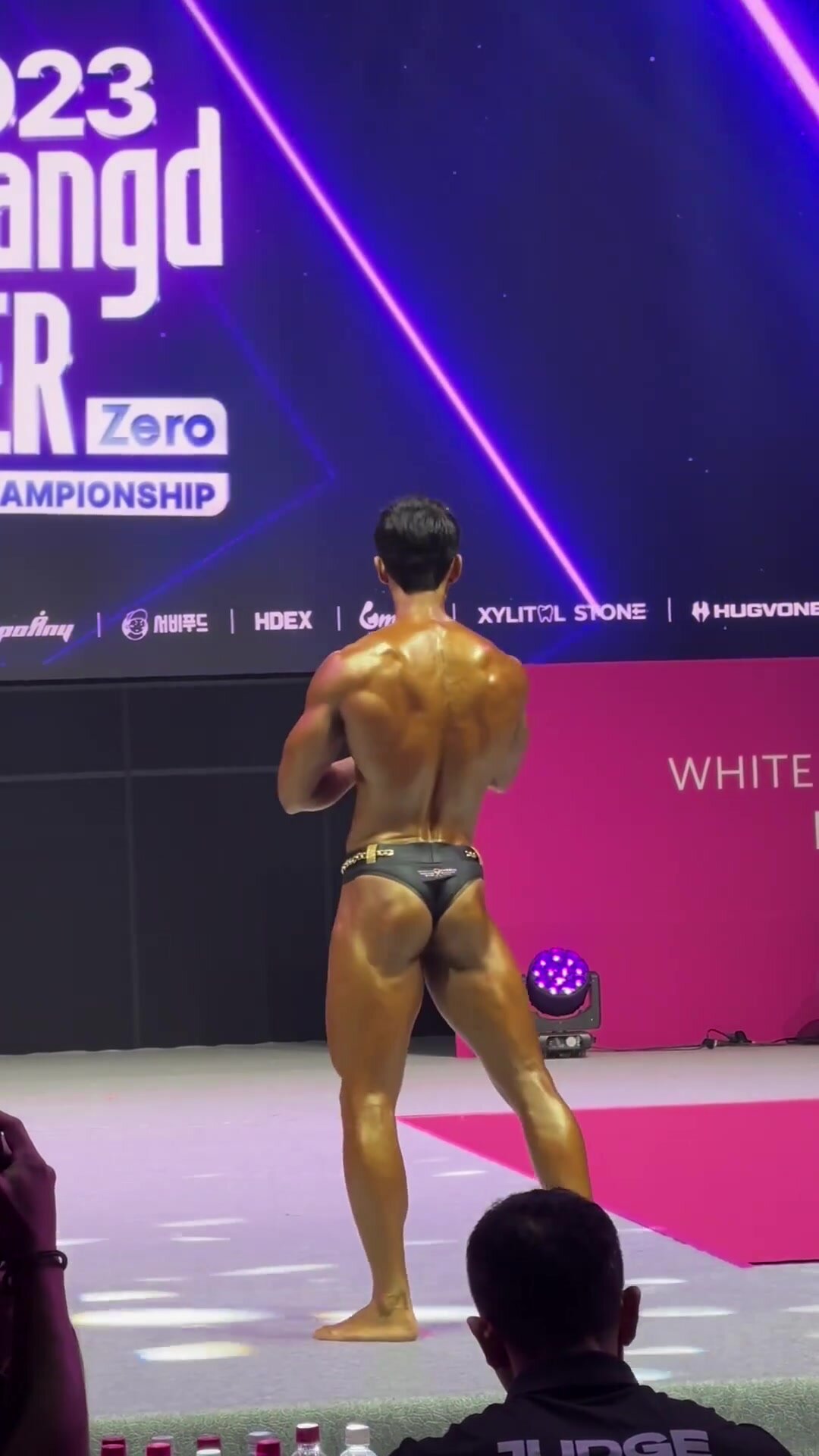 Asian bodybuilder struts his stuff