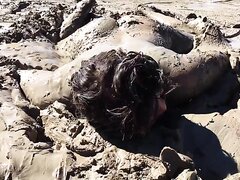 girl enjoying the mud - video 2