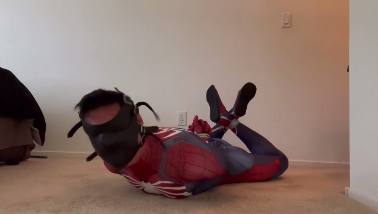 JHardcastle82 : Hogtied in Spider-Man suit with Muzzle