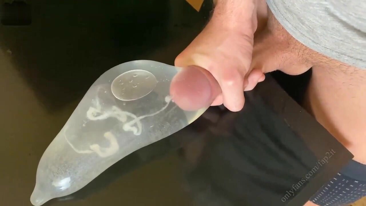 cums in water-filled condom