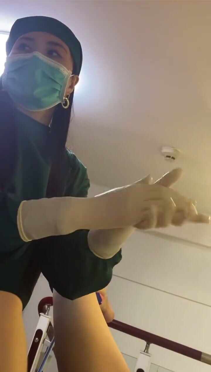 Asian nurse oils her gloves, jerks her patients dick