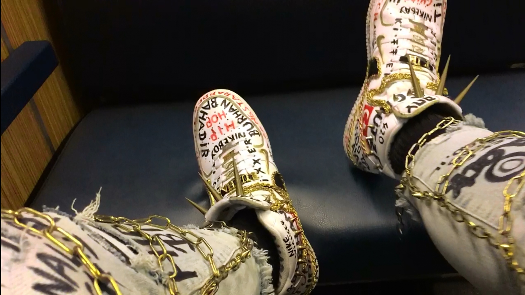 sneakers on seat in Metro