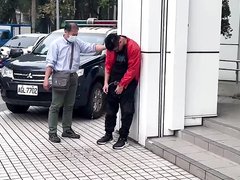 Asian guy pisses in public