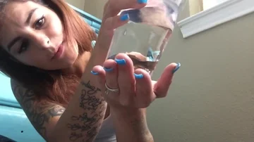 Hot tattooed girl swallows live fish ThisVid com em inglês 