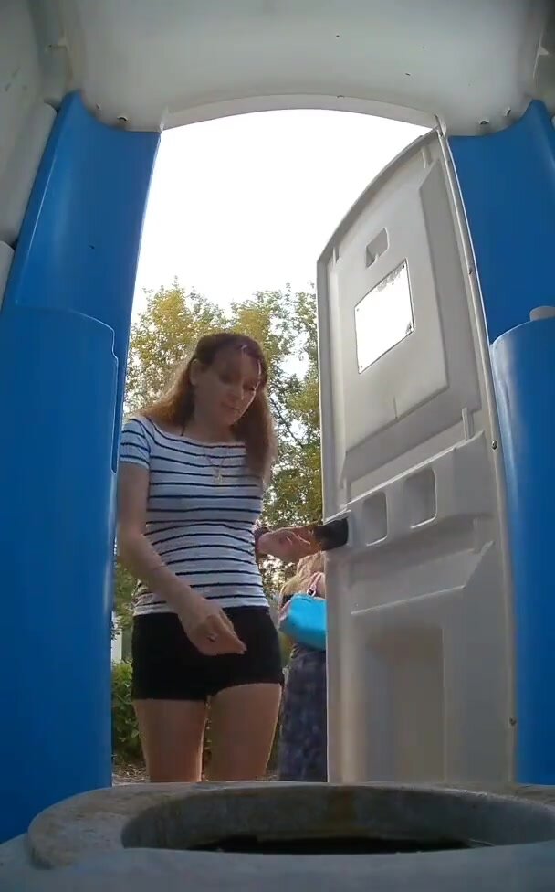Porta potty spycam catches padded girl peeing