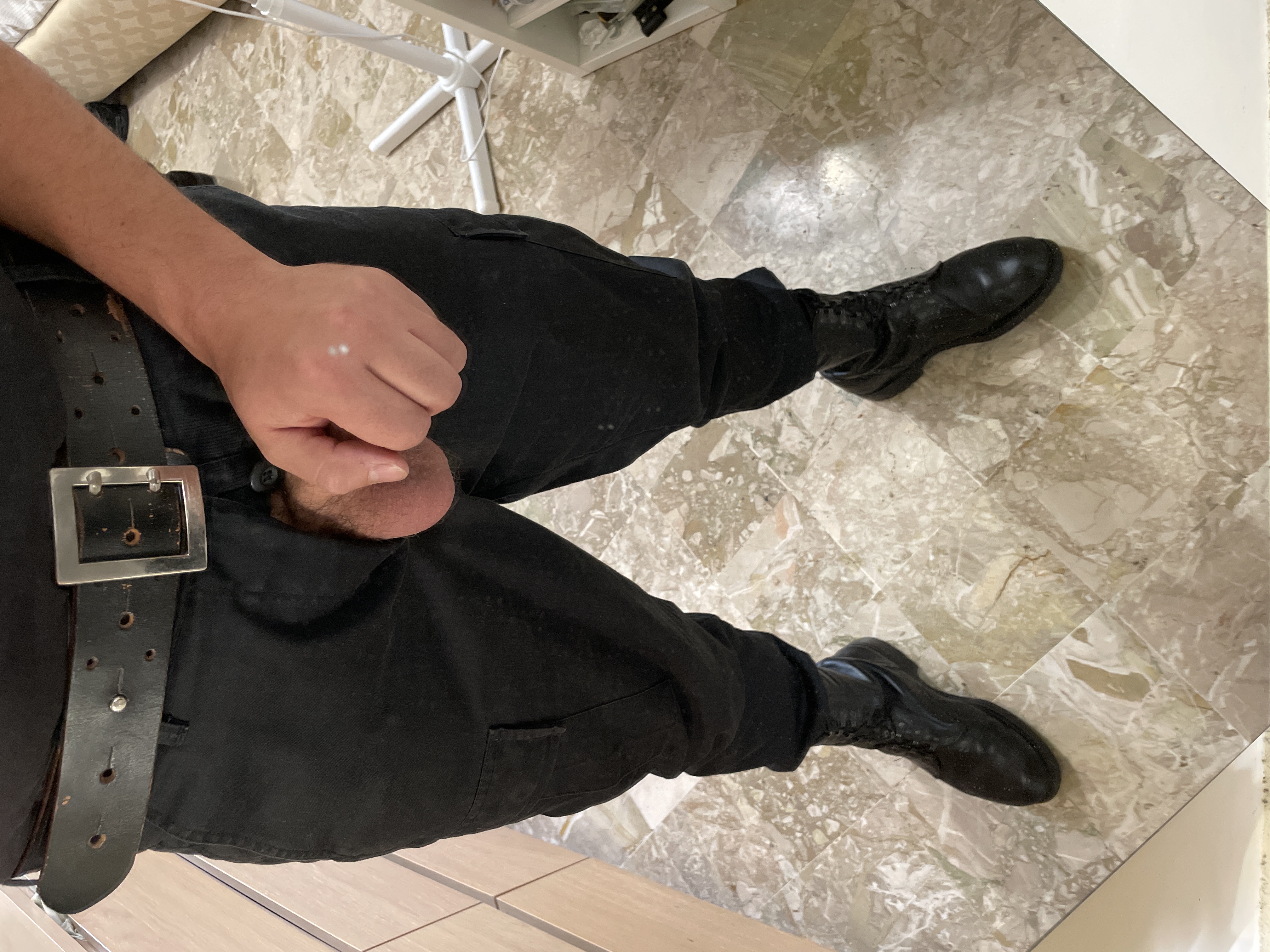 Military gay in boots and belt