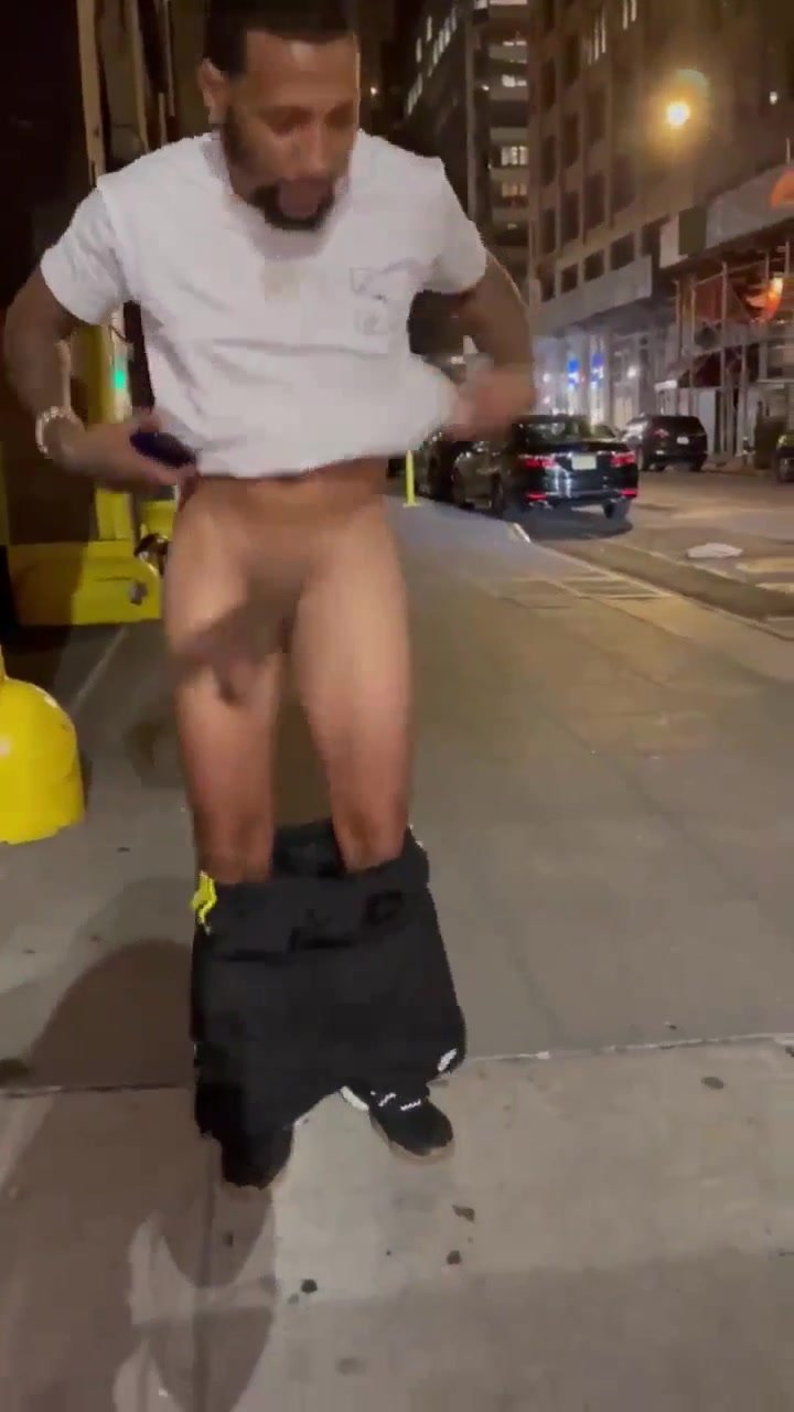 Handsome guy shaking his huge soft cock in public