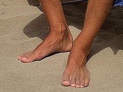 Young feet on the beach