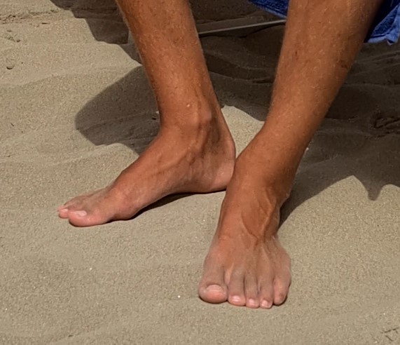 Young feet on the beach