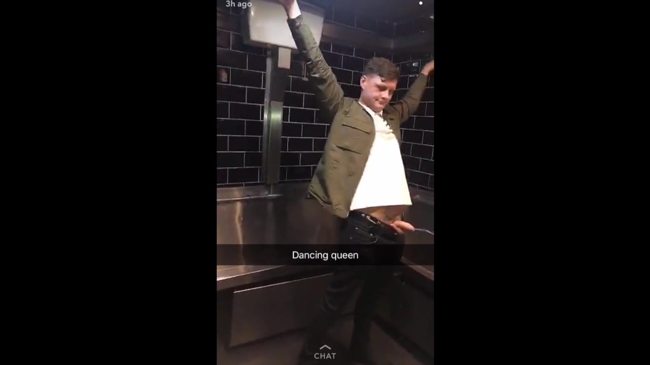 Drunk rugby lad pissing all over the pub toilet