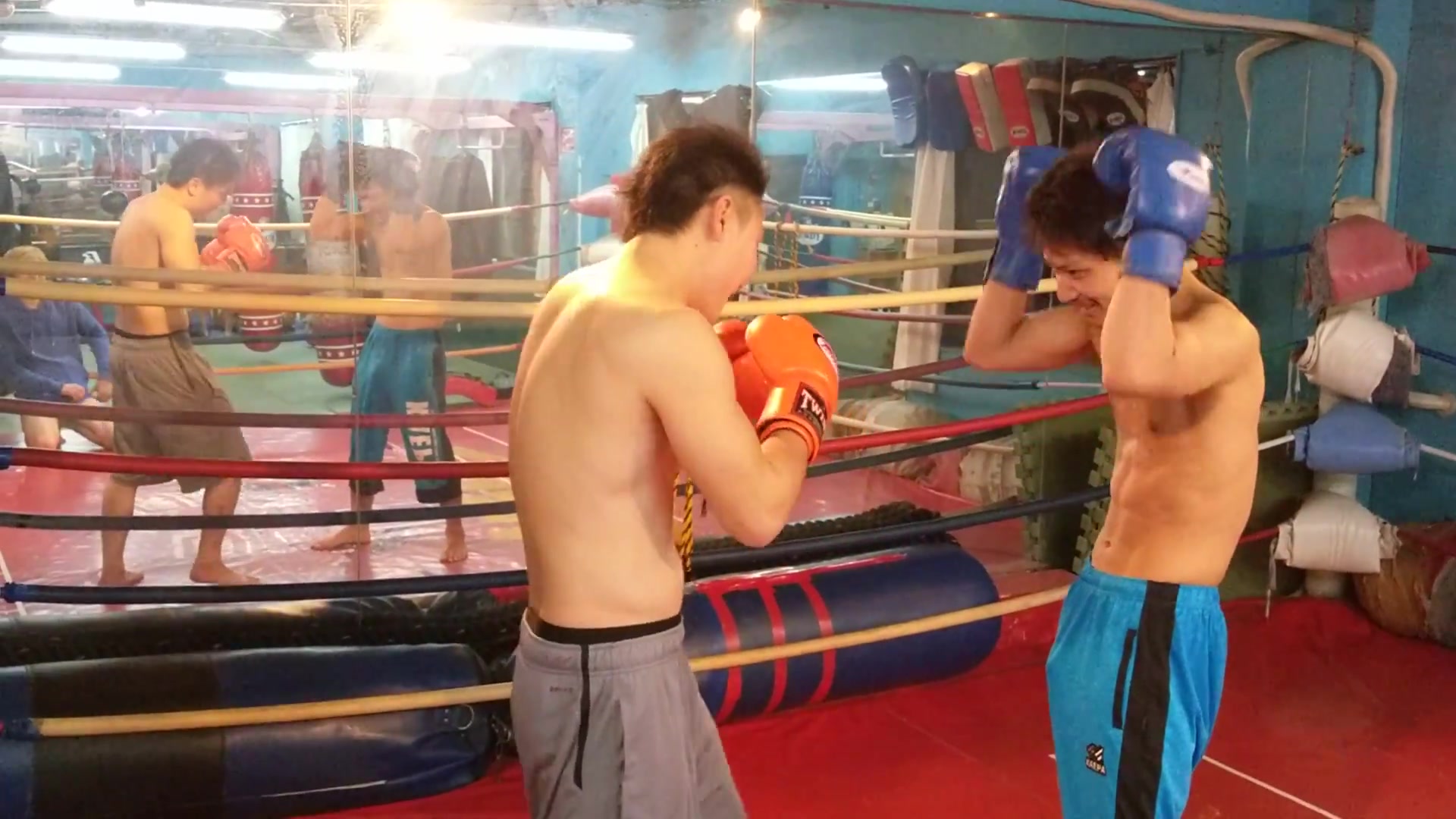 Asian Boxers Take Turns Gut Punching