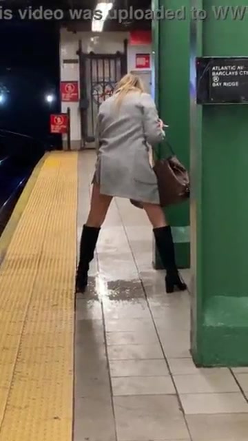 Careless Woman pissing on subway platform