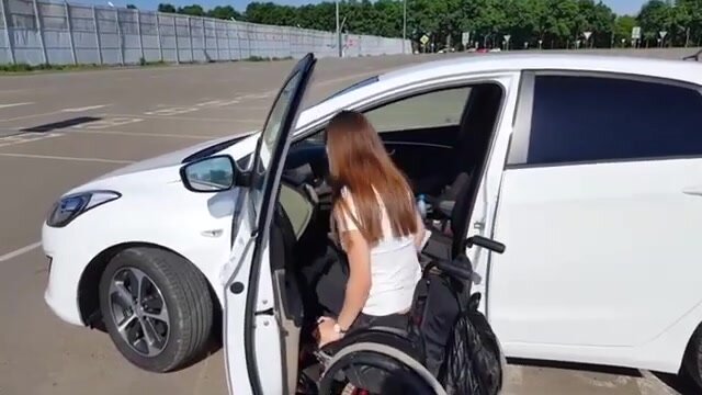 Paraplegic Woman wheelchair transfer demos