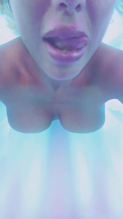 Nude in tanning bed