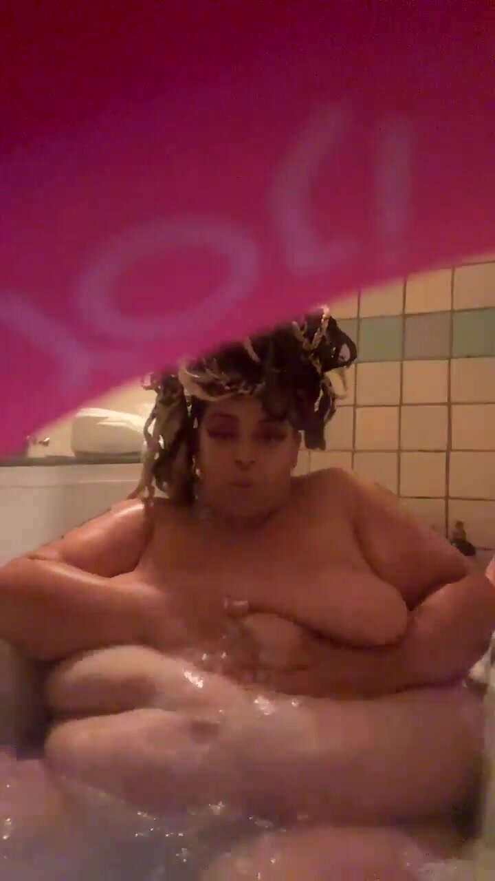 huge ebony taking a shower
