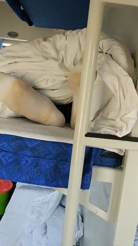friend grabs and sniffs his friend's dirty socks while