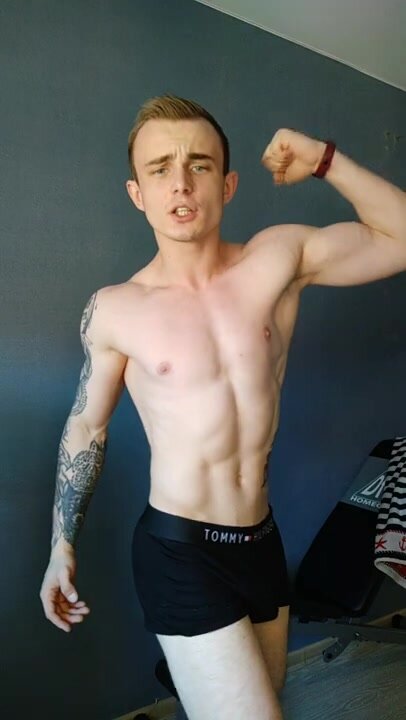 posing flex young bodybuilder