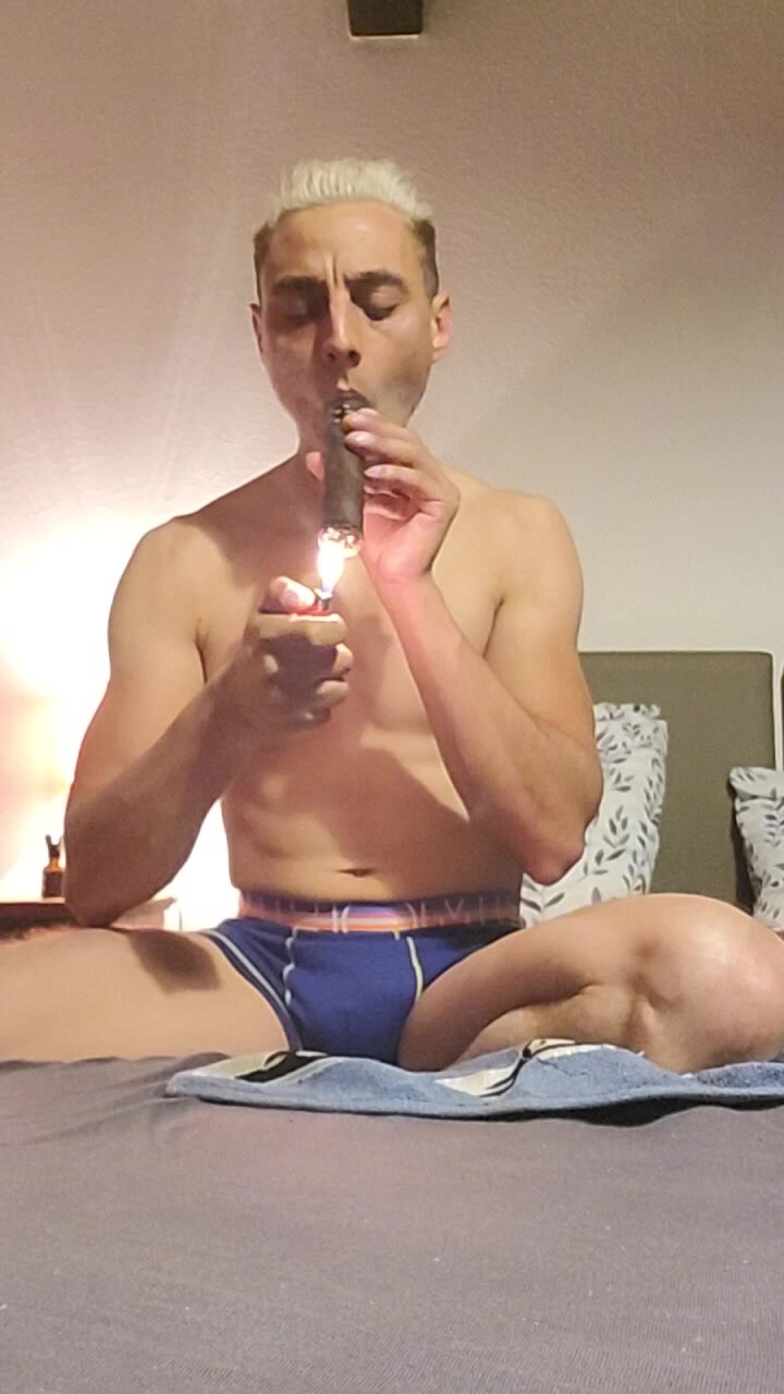 Blond twink smoking cigar - lighting up