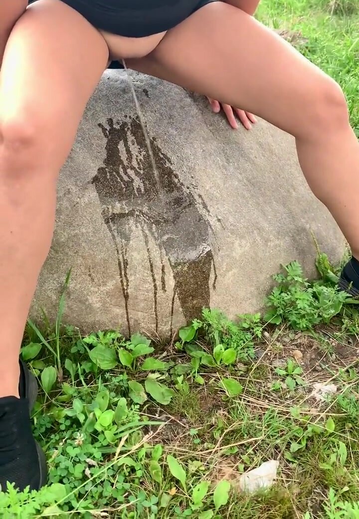 Cute stream forcefully hits & wets the rock in nature