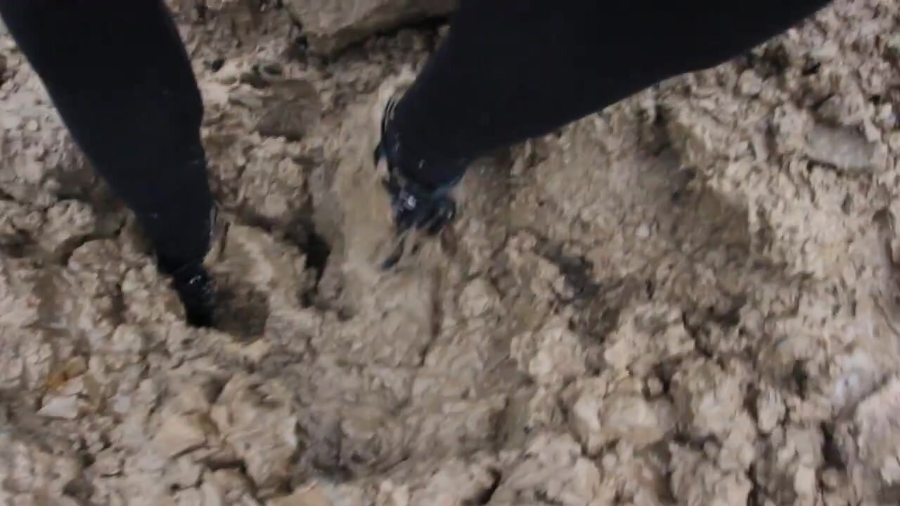 Black Ankle Boots Stuck in Mud