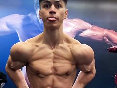young bodybuilder showing his pumped muscle flexing