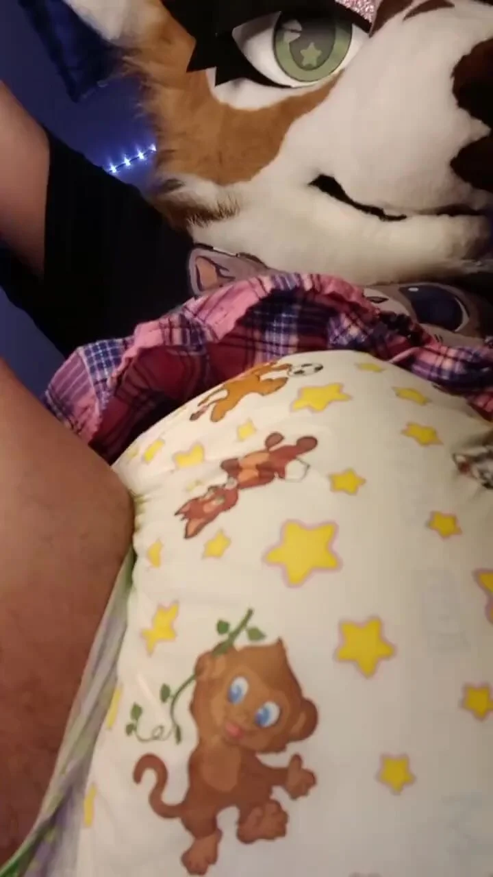 Fursuiter sits on you and messes her diaper - ThisVid.com