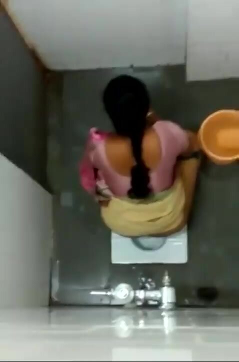 Cute Tamil woman caught using a squat toilet (peeing)